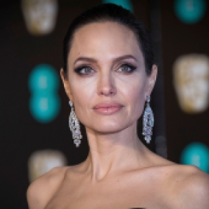 Mandatory Credit: Photo by Vianney Le Caer/Invision/AP/REX/Shutterstock (9421617ja) Angelina Jolie poses for photographers upon arrival at the BAFTA Film Awards, in London Britain BAFTA Awards 2018 Arrivals, London, United Kingdom - 18 Feb 2018